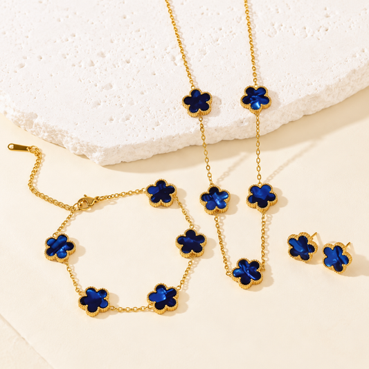 Parure Florélia bleu nuit à reflets : collier, bracelet et boucles d’oreilles à motifs fleuris dorés